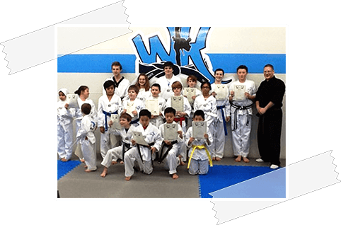 World Karate summer camp enrollees showing their karate certificates